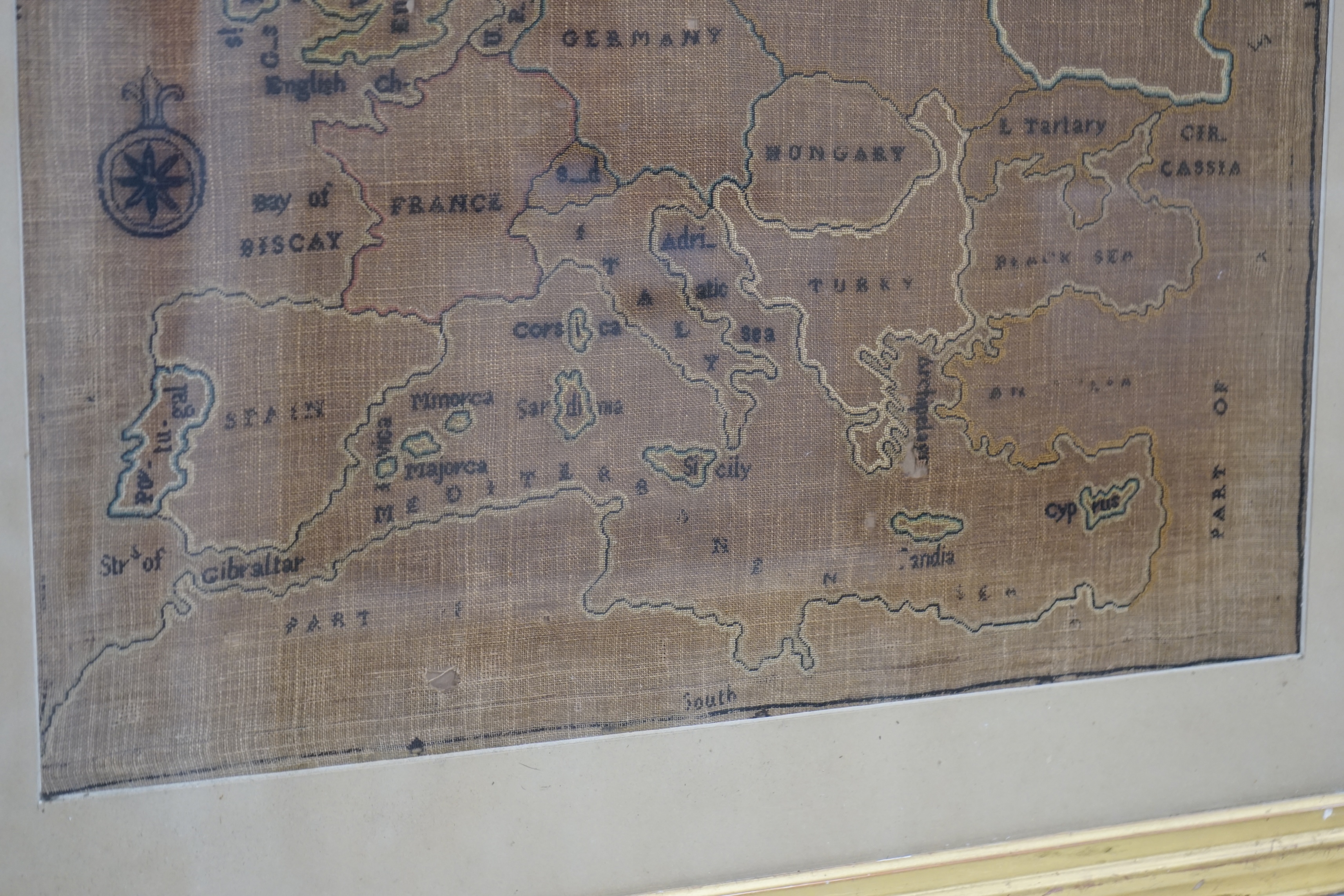 A late 19th century map sampler of Europe, linen backing discoloured by the light and sun, 46cm wide, 47.5cm high. Condition - fair, discolouration and staining
